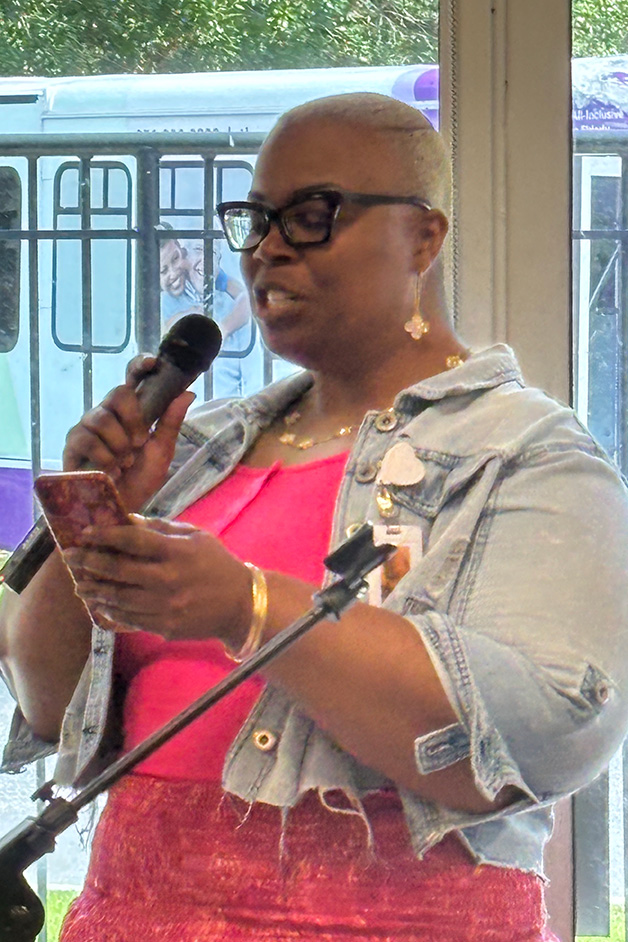 Trinity Health PACE of Pensacola colleague performing a singing tribute during Mrs. Kay's 105th birthday celebration.
